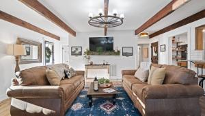 a living room with two couches and a tv at 8 Mile House by AvantStay in Santa Margarita
