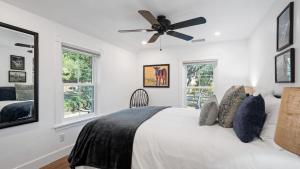 a bedroom with a bed with a ceiling fan at 8 Mile House by AvantStay in Santa Margarita