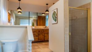 a bathroom with a sink and a toilet and a shower at Na Hoku Ranch by AvantStay in Atascadero +47 photos