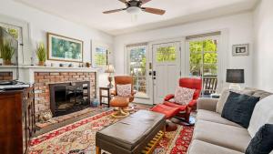 a living room with a couch and a fireplace at Chateau Paso by AvantStay in Paso Robles