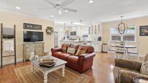 a living room with a couch and a table at 13th Street Retreat by AvantStay in Paso Robles