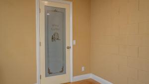 a room with a glass door with a sign on it at 13th Street Retreat by AvantStay in Paso Robles