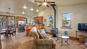 a living room with a couch and a table at Vita Amorosa by AvantStay in Atascadero