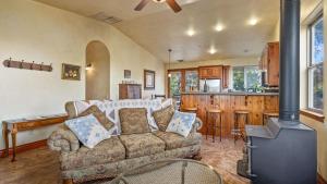 a living room with a couch and a stove at Vita Amorosa by AvantStay in Atascadero