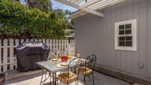 a table and chairs sitting on a patio at The Sycamore by AvantStay in Paso Robles