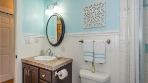 a bathroom with a sink and a toilet and a mirror at The Sycamore by AvantStay in Paso Robles +18 photos