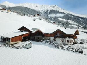a lodge in the snow with mountains in the background at Panoramic View Suite on the Kaunergrat in Kaunerberg