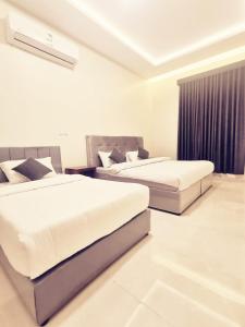 a bedroom with two beds and a window at استراحه الصفا in Medina +29 photos