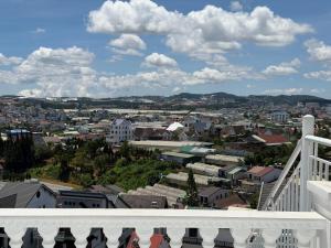 a view of a city from a balcony at Celine Privé - Dalat Hotel in Da Thien