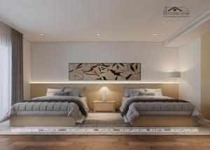 a bedroom with two beds and a painting on the wall at Khách sạn L'Aur in Cửa Lô