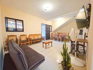 a living room with a couch and a table at Guadalupe House Esquipulas in Esquipulas