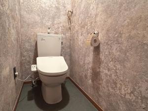 a bathroom with a toilet and a roll of toilet paper at Deer Path Nara in Nara +22 photos