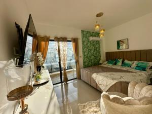 a hotel room with a bed and a window at Villa Luminosa in Punta Cana