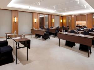 a dining room with tables and chairs in a room at Novotel Bali Benoa in Nusa Dua +108 photos