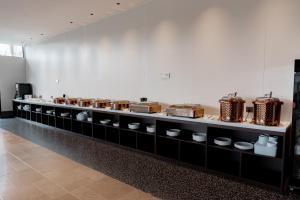 a long counter with drums on it in a room at vangvieng THAVIKUN HOTEL in Vang Vieng
