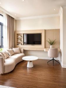 a living room with a couch and a table at Annava Hotel & Coffee in Hai Phong +11 photos