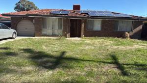 a house with solar panels on the roof at Room 1 Bright Spacious Room Walk to Shops in Kelmscott