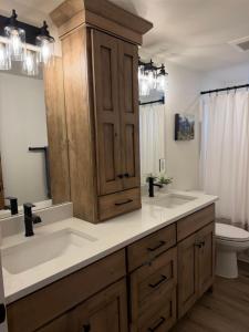 a bathroom with a sink and a toilet at Hungry Horse Farmhouse in Hungry Horse +41 photos