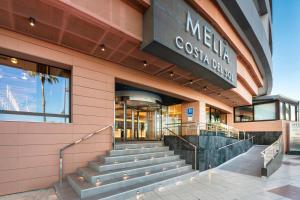 a building with stairs in front of a store at Meliá Costa del Sol in Torremolinos