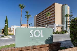 a sign for a hotel in front of a building at SOL by Meliá Málaga Guadalmar in Málaga +52 photos