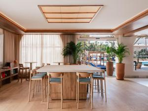 a dining room with a table and chairs at ME by Meliá Marbella in Marbella