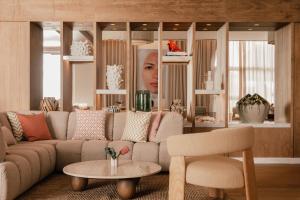 a living room with a couch and a table at ME by Meliá Marbella in Marbella