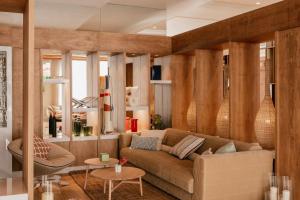 a living room with a couch and a table at ME by Meliá Marbella in Marbella +73 photos