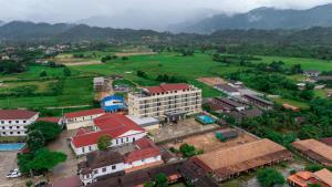 an aerial view of a town with mountains in the background at Vangvieng THAVIKUN HOTEL in Vang Vieng