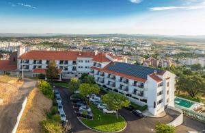 an overhead view of a building with solar panels on the roof at Meliá Castelo Branco in Castelo Branco