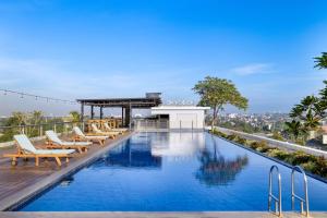 a pool on the roof of a building at INNSiDE by Meliá Yogyakarta in Yogyakarta