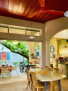 a dining room with a table and chairs at Brother House in Nha Trang +28 photos