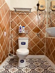 a bathroom with a toilet and a sink at Brother House in Nha Trang