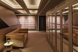 a living room with a couch and a table at MiM Andorra member of Meliá Collection in Escaldes-Engordany