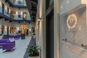 a glass door of a building with a number on it at Hotel President Budapest, Affiliated by Meliá in Budapest