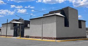a building sitting on the side of a street at VIRREYES418 extended apartments in Los Valdeses
