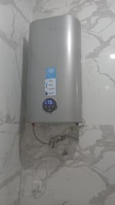 a metal appliance on a white marble counter top at Only in M'diq