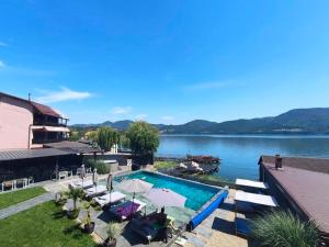 a swimming pool with a view of a lake at Donau Resort in Eşelniţa