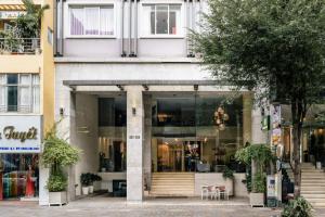 a store front of a building on a street at Nicecy Ben Thanh Hotel in Ho Chi Minh City