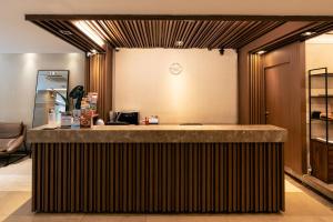 a bar in a room with a counter at Nicecy Ben Thanh Hotel in Ho Chi Minh City
