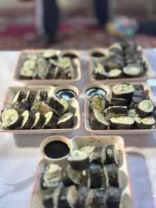 a table with three trays of different types of desserts at OrdoLife in Mineralʼnyy Istochnik Altyn-Arasan