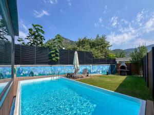 a swimming pool in the backyard of a house at Egem Tatil Evleri in Fethiye