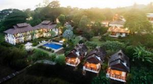 an aerial view of a house with a swimming pool at Gin's Greenery Resort in Ban Hua Wiang