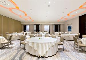 a conference room with white tables and chairs at Andaz San Diego, By Hyatt in San Diego +83 photos