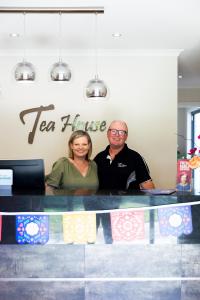 a man and a woman standing behind a counter at Tea House Motor Inn in Bendigo +118 photos