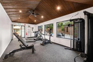 a gym with treadmills and elliptical machines at Quality Hotel City Centre in Coffs Harbour