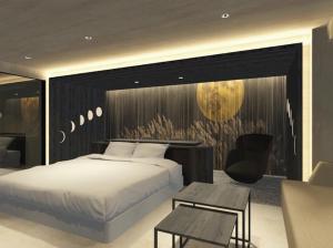 a bedroom with a bed and a table and a couch at Hotel MAISAKURA MIYABI in Nara