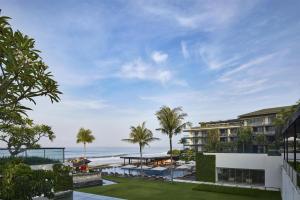 a view of the ocean from the balcony of a building at Alila Seminyak in Seminyak