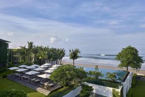 an aerial view of a resort with a beach at Alila Seminyak in Seminyak