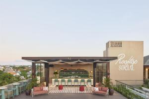 a restaurant on the roof of a building at Kleo Seminyak, part of JdV by Hyatt in Seminyak