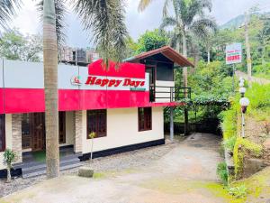 a happy day sign on the side of a building at Happy Days by 3R Munnar in Munnar